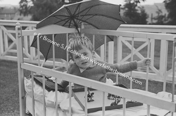 LOURDES HOSPITAL CHILD WITH PARASOL  PADDY GARVEY  20 ST MARYS TERRACE